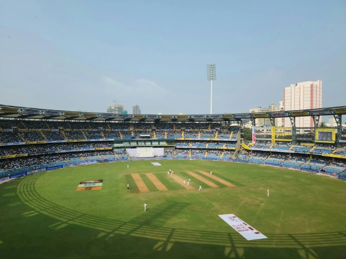 A cricket stadium filled with lots of people